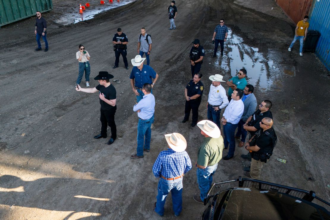 Elon Musk, wearing a black Stetson hat, livestreams while visiting the US-Mexico border in Eagle Pass, Texas, on September 28, 2023. Critics accused him of painting a slanted portrait of the situation, but officials who spoke with Musk that day praised him.