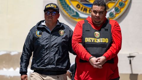 Peruvian police carry out the transfer of one of the  of the Tren de Aragua criminal organization in Lima on October 5, 2023. Peruvian police on Thursday captured the alleged leader and 31 other  of a faction of the Tren de Aragua, the Venezuelan-born criminal organization that sows terror in several South American countries with murders and extortion, according to authorities. The offensive against what is considered the most dangerous gang operating in Peru was carried out in several regions of the country. (Photo by Cris BOURONCLE / AFP) (Photo by CRIS BOURONCLE/AFP via Getty Images)