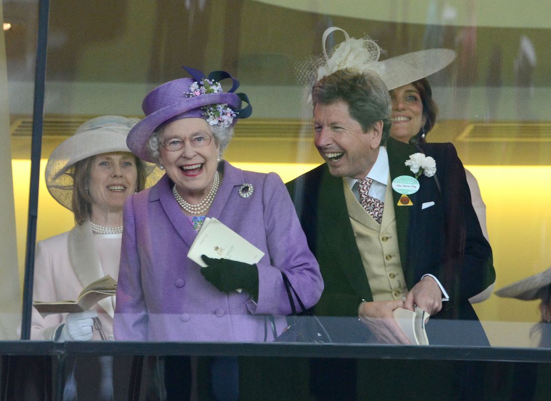 Queen Elizabeth II and John Warren cheer on her horse Estimate to win the Gold Cup at Royal Ascot on June 20, 2013.