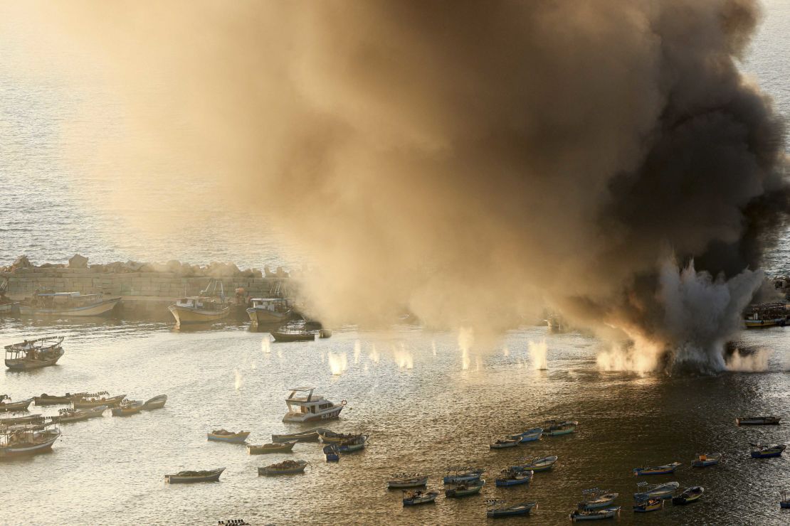 Smoke billows after a strike by Israel on the port of Gaza City on October 10.