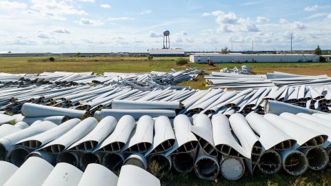SWEETWATER, TEXAS - OCTOBER 04: In an aerial view, discarded wind turbine blades are seen in a field next to the Sweetwater Cemetery on, October 04, 2023 in Sweetwater, Texas. General Electric filed a lawsuit against Global Fiberglass, claiming that the company has failed to recycle thousands of turbine blades discarded in a field on the west side of town. (Photo by Brandon Bell/Getty Images)