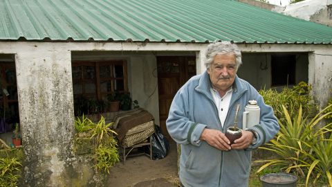 Uruguayan President Jose Mujica stands in front of his house in Montevideo on June 25, 2013. AFP PHOTO / MARIO GOLDMAN (Photo credit should read MARIO GOLDMAN/AFP via Getty Images)