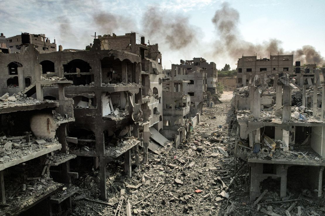 TOPSHOT - This picture taken on October 11, 2023 shows an aerial view of buildings destroyed by Israeli air strikes in the Jabalia camp for Palestinian refugees in Gaza City. Israel declared war on Hamas on October 8 following a shock land, air and sea assault by the Gaza-based Islamists. The death toll from the shock cross-border assault by Hamas militants rose to 1,200, making it the deadliest attack in the country's 75-year history, while Gaza officials reported more than 900 people killed as Israel pounded the territory with air strikes. (Photo by Yahya HASSOUNA / AFP) (Photo by YAHYA HASSOUNA/AFP via Getty Images)