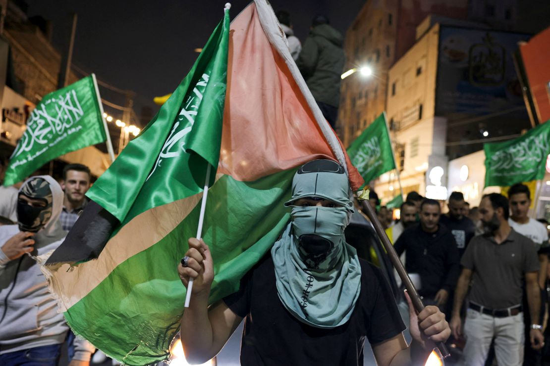 Hamas supporters march in Hebron in the occupied West Bank on October 11, 2023.