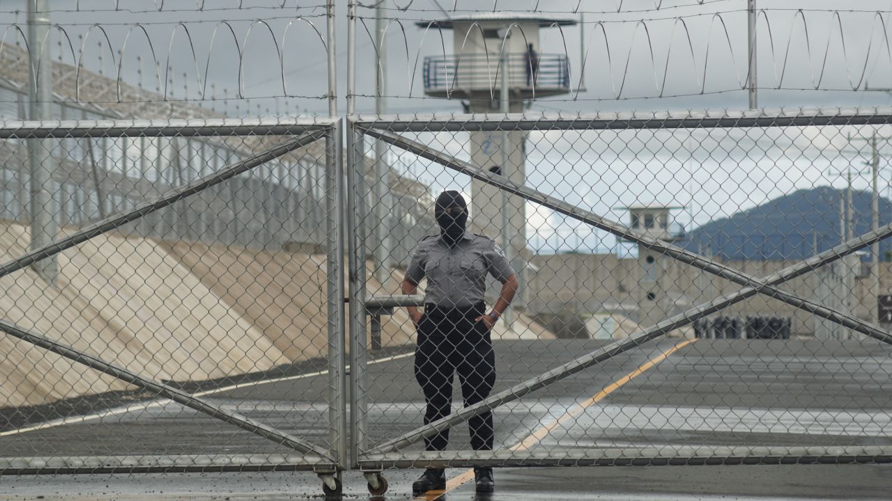 TECOLUCA, EL SALVADOR - OCTOBER 12: A prison officer guards a gate inside at CECOT (Spanish acronym for counter-terrorism confinement center) on October 12, 2023 in Tecoluca, El Salvador. On February of 2023 El Salvador inaugurated Latin America's largest prison as part of President Nayib Bukele's plan to fight gangs. Since then, the UN and NGOs have raised concern about the treatment of inmates, minors being held and suspects incarcerated as gang without sufficient proof. Meanwhile, Bukele claims El Salvador's murder rate has fallen from the world's highest to the lowest in the Western Hemisphere. (Photo by Alex Peña/Getty Images)