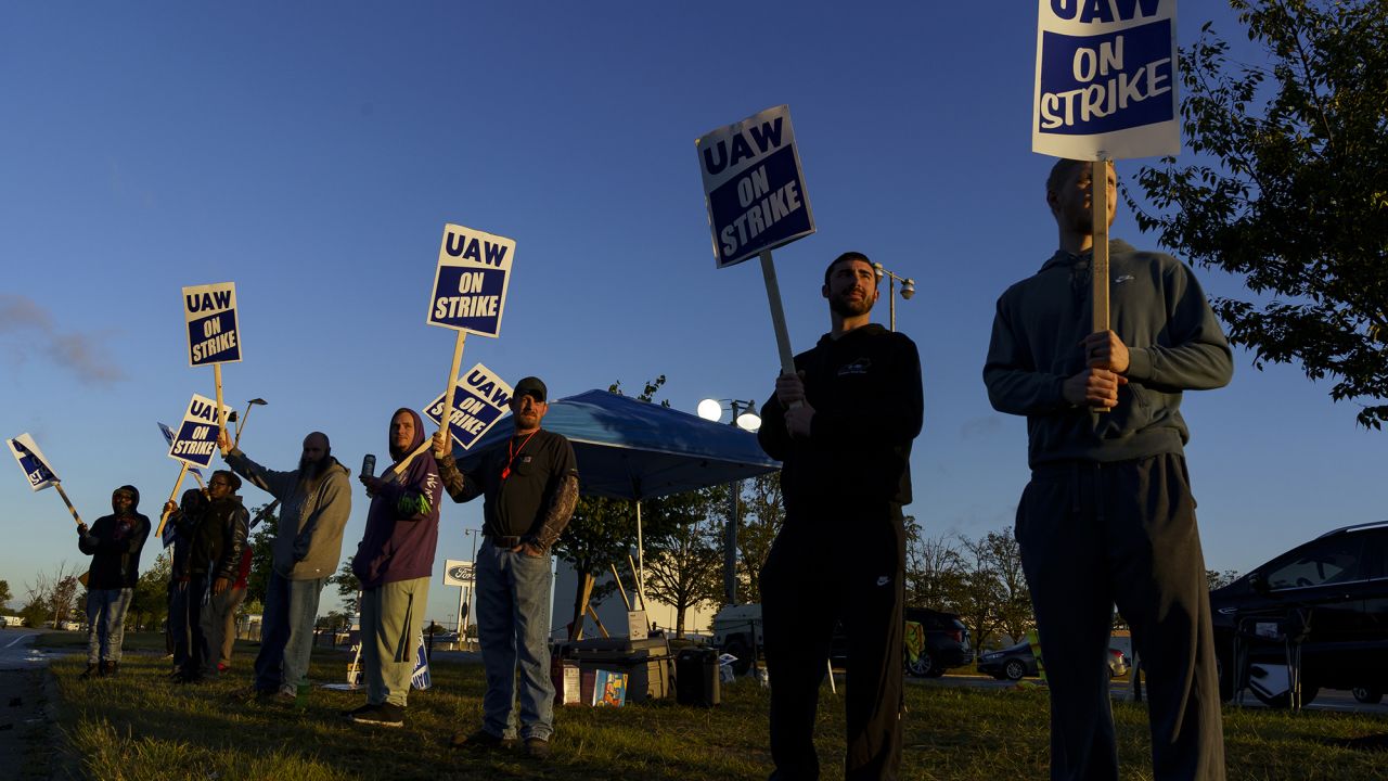 Factory workers and UAW union members form a picket line outside the Ford Motor Co. Kentucky Truck Plant in the early morning hours on October 14, 2023 in Louisville, Kentucky.