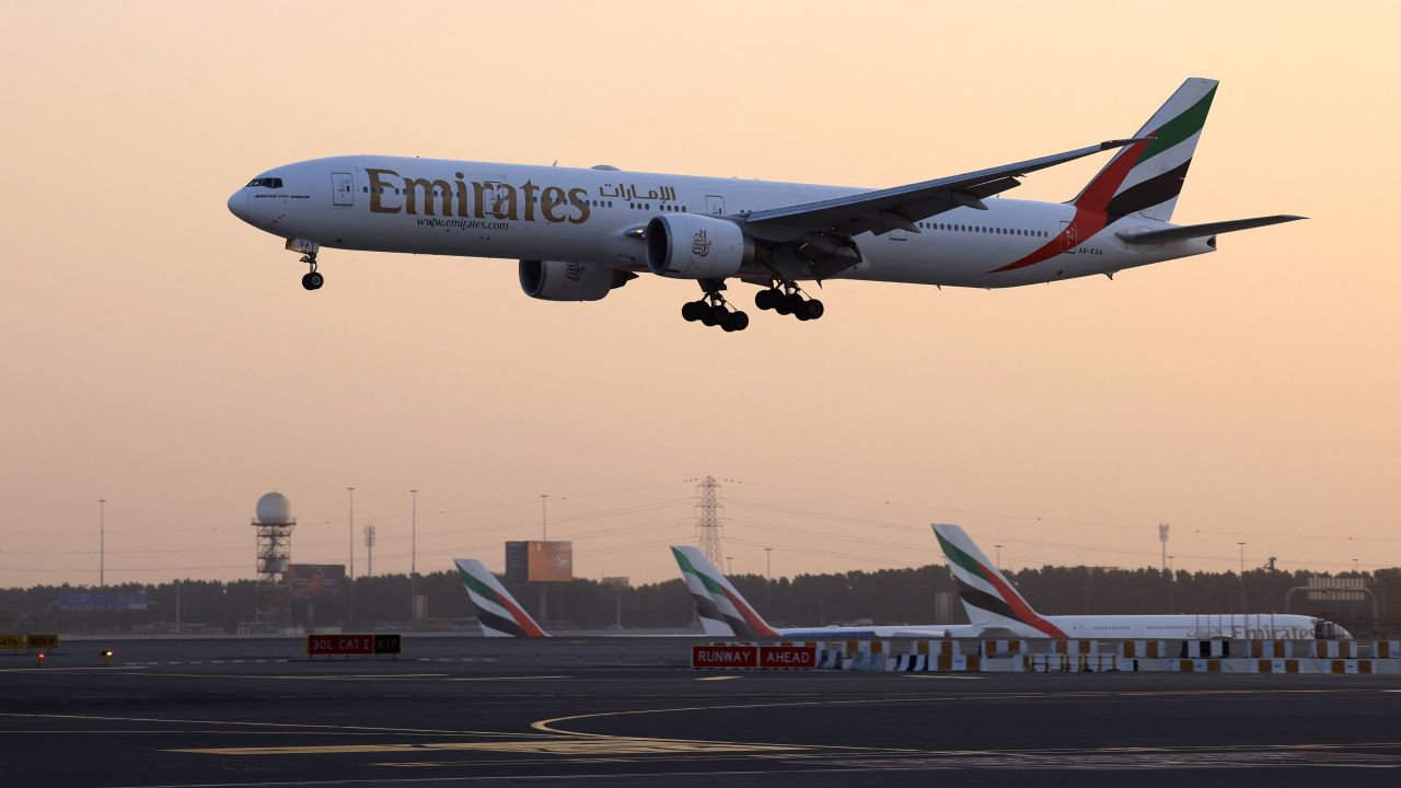 An Emirates Airlines plane lands at Dubai International Airport in Dubai on October 17, 2023. (Photo by Karim SAHIB / AFP) (Photo by KARIM SAHIB/AFP via Getty Images)