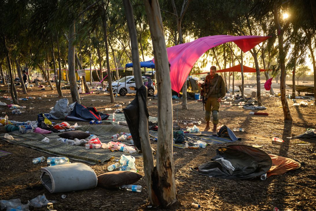 Members of the Israeli security forces continue to search for identification documents and belongings at the Nova Music Festival venue near the Gaza border in Kibbutz Rem, Israel, on October 12, 2023.