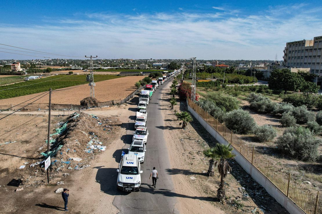 Humanitarian aid trucks arriving from Egypt after having crossed through the Rafah border crossing arrive at a storage facility in Khan Younis, in the southern Gaza Strip on October 21.