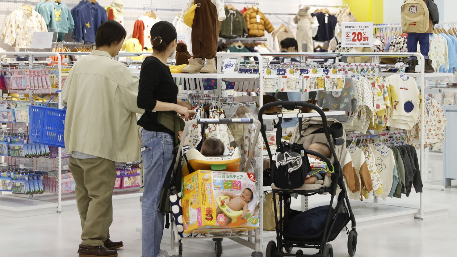 Customers browse children's clothes at a mall in Kyoto on October 20, 2023.