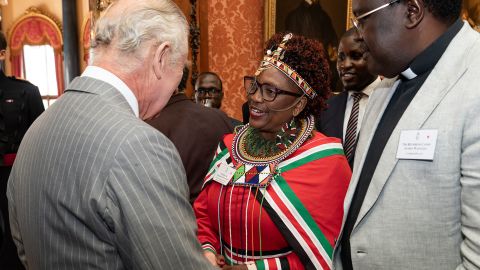 King Charles chats with guests at a reception for the Kenya diaspora at Buckingham Palace on October 24.