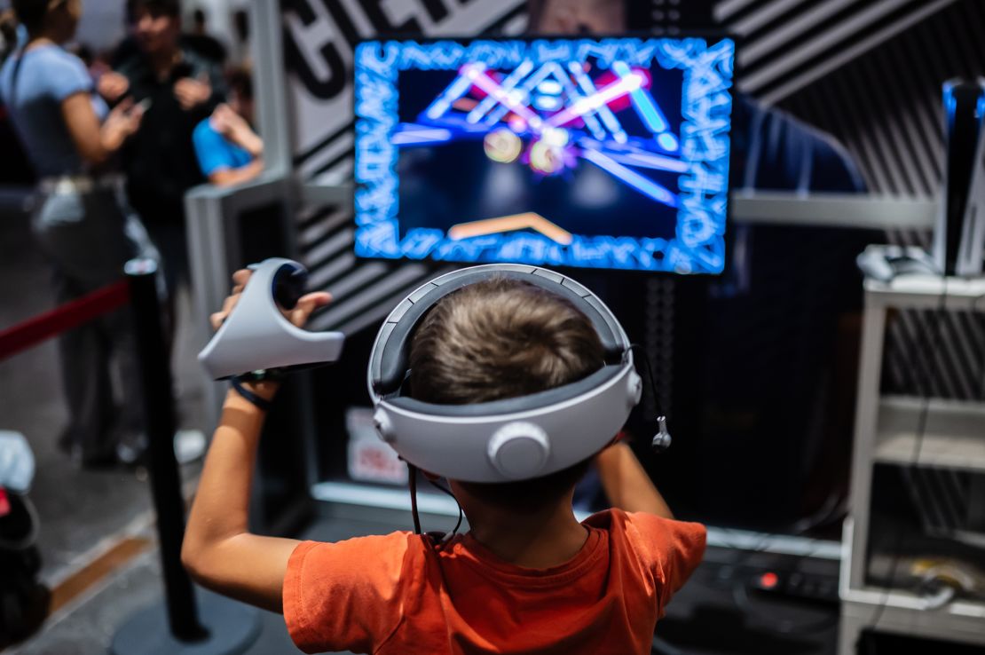 A young boy plays with Meta Quest 2 all-in-one VR headset during a festival of video games and other digital entertainment in Zaragoza, Spain, on October 15, 2023.