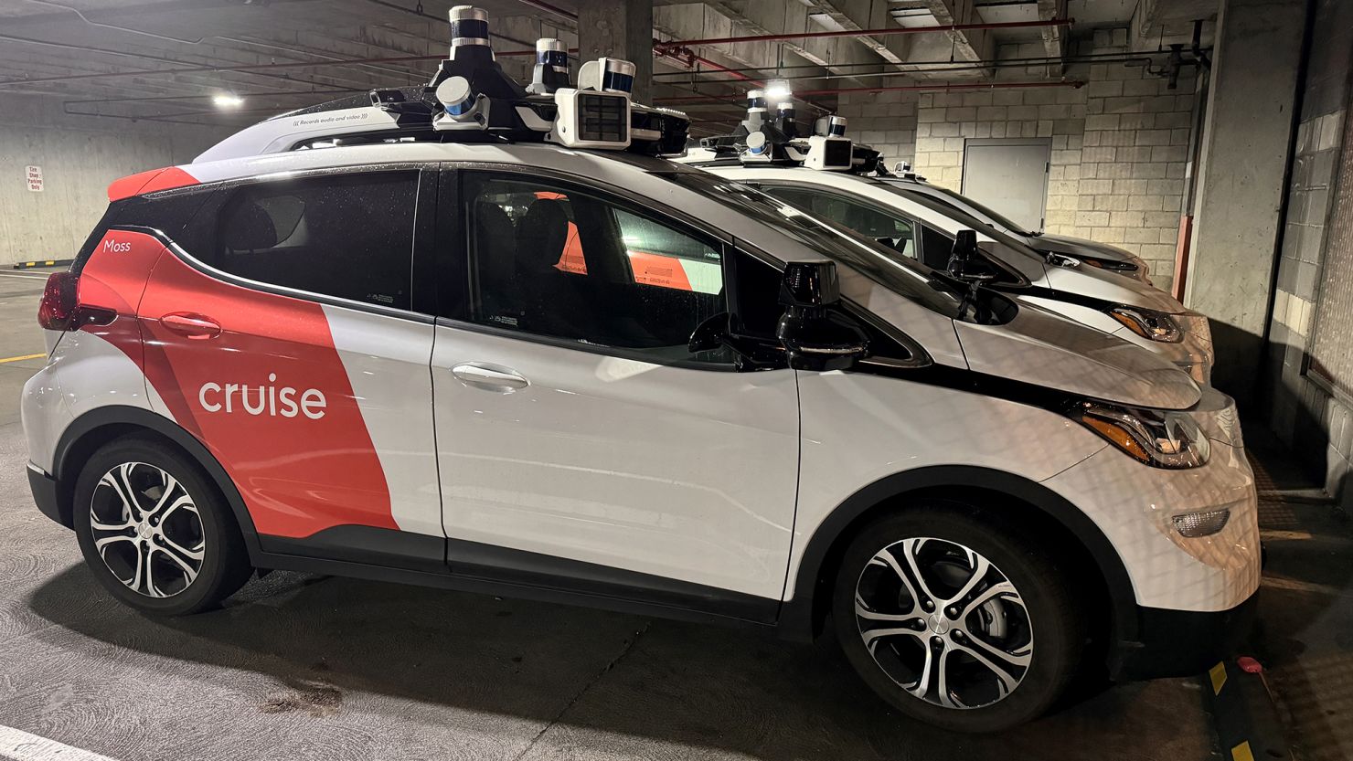 'Cruise' driverless robot taxis in a parking facility.