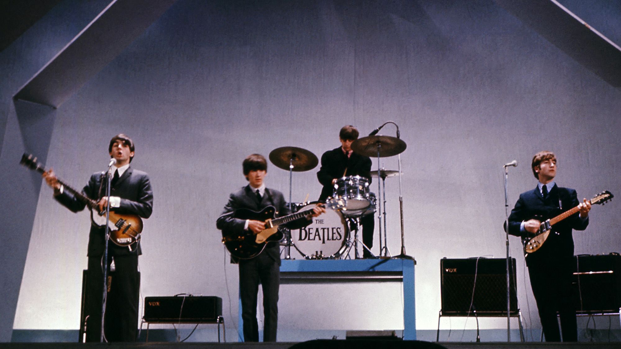 The Beatles (from left to right), Paul McCartney (playing the stolen bass), George Harrison, Ringo Starr and John Lennon perform during a concert on July 29, 1965.