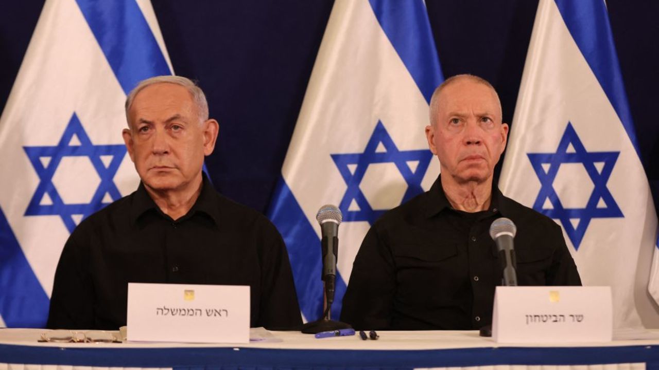 TOPSHOT - Israeli Prime Minister Benjamin Netanyahu (L) and Defence Minister Yoav Gallant attend a press conference in the Kirya military base in Tel Aviv on October 28, 2023 amid ongoing battles between Israel and the Palestinian group Hamas. Netanyahu said on October 28 that fighting inside the Gaza Strip would be "long and difficult", as Israeli ground forces operate in the Palestinian territory for more than 24 hours. (Photo by Abir SULTAN / POOL / AFP) (Photo by ABIR SULTAN/POOL/AFP via Getty Images)