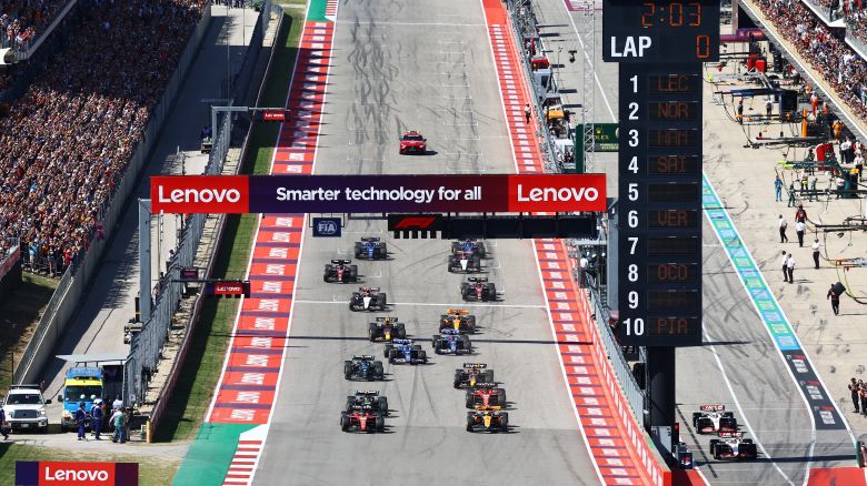 Charles Leclerc of Monaco driving the (16) Ferrari SF-23 and Lando Norris of Great Britain driving the (4) McLaren MCL60 Mercedes lead the field at the start during the F1 Grand Prix of United States at Circuit of The Americas on October 22, 2023 in Austin, Texas.