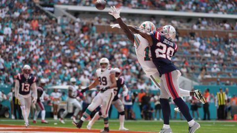 Miami Dolphins wide receiver Tyreek Hill (10) can't reach the ball but New England Patriots cornerback J.C. Jackson (29) gets flagged on the call during the game between the New England Patriots and the Miami Dolphins on Sunday, October 29, 2023 at Hard Rock Stadium, Miami Gardens, Fla.