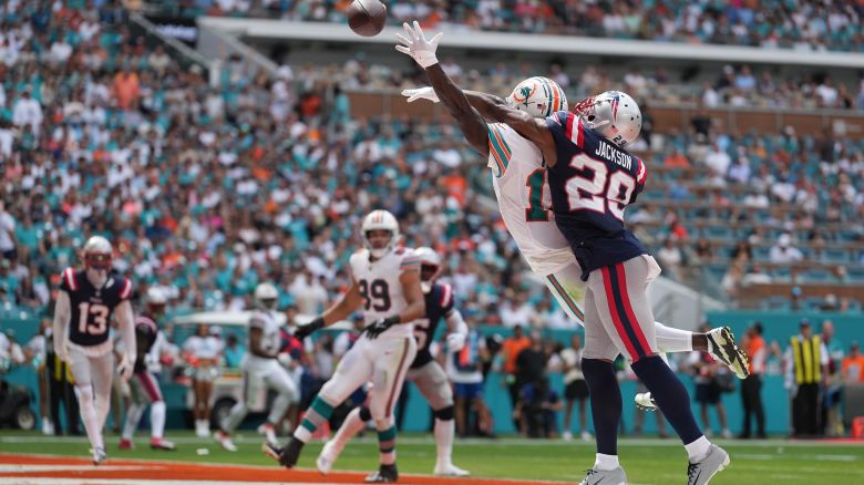 Miami Dolphins wide receiver Tyreek Hill (10) can't reach the ball but New England Patriots cornerback J.C. Jackson (29) gets flagged on the call during the game between the New England Patriots and the Miami Dolphins on Sunday, October 29, 2023 at Hard Rock Stadium, Miami Gardens, Fla.