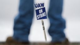 A "UAW On Strike" sign near a picket line outside the General Motors Co. Spring Hill Manufacturing plant in Spring Hill, Tennessee, US, on Monday, Oct. 30, 2023. General Motors Co. reached a tentative agreement with the United Auto Workers, according to people familiar with the matter, bringing an end to a six-week-old strike that had upended US automobile production and cost the industry billions of dollars.
