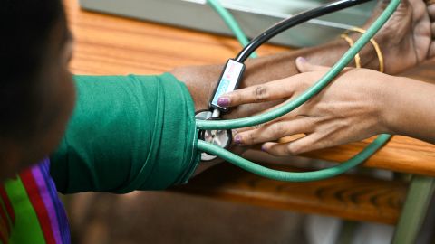 Medical staff checks the blood pressure of woman before consulting a doctor at the Free Orthopaedic Camp inside the Vijay Marie Hospital in Hyderabad on October 31, 2023. (Photo by NOAH SEELAM / AFP) (Photo by NOAH SEELAM/AFP via Getty Images)