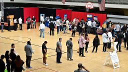 People wait in line for a chance to speak with prospective employers during a City of Los Angeles career fair offering to fill vacancies in more than 30 classifications of jobs on November 2, 2023 in Los Angeles, California.