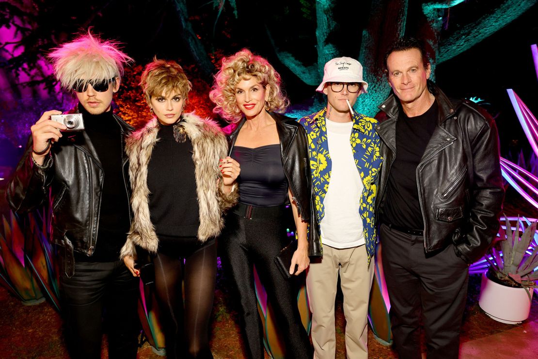 From left: Austin Butler as Andy Warhol and Kaia Gerber as Edie Sedgwick, Cindy Crawford as Sandy Olsson from the movie "Grease," Presley Gerber as Raoul Duke from the movie "Fear and Loathing in Las Vegas" and Rande Gerber as Danny Zuko from "Grease."