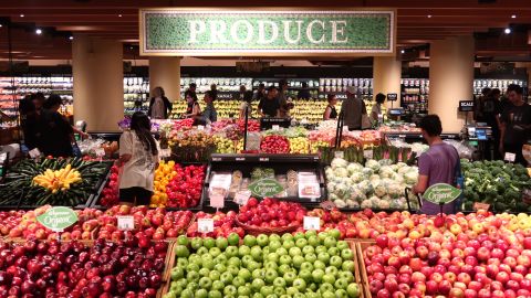 People walk through the produce department at the new Wegmans Astor Place grocery store on October 28, 2023, in New York City.