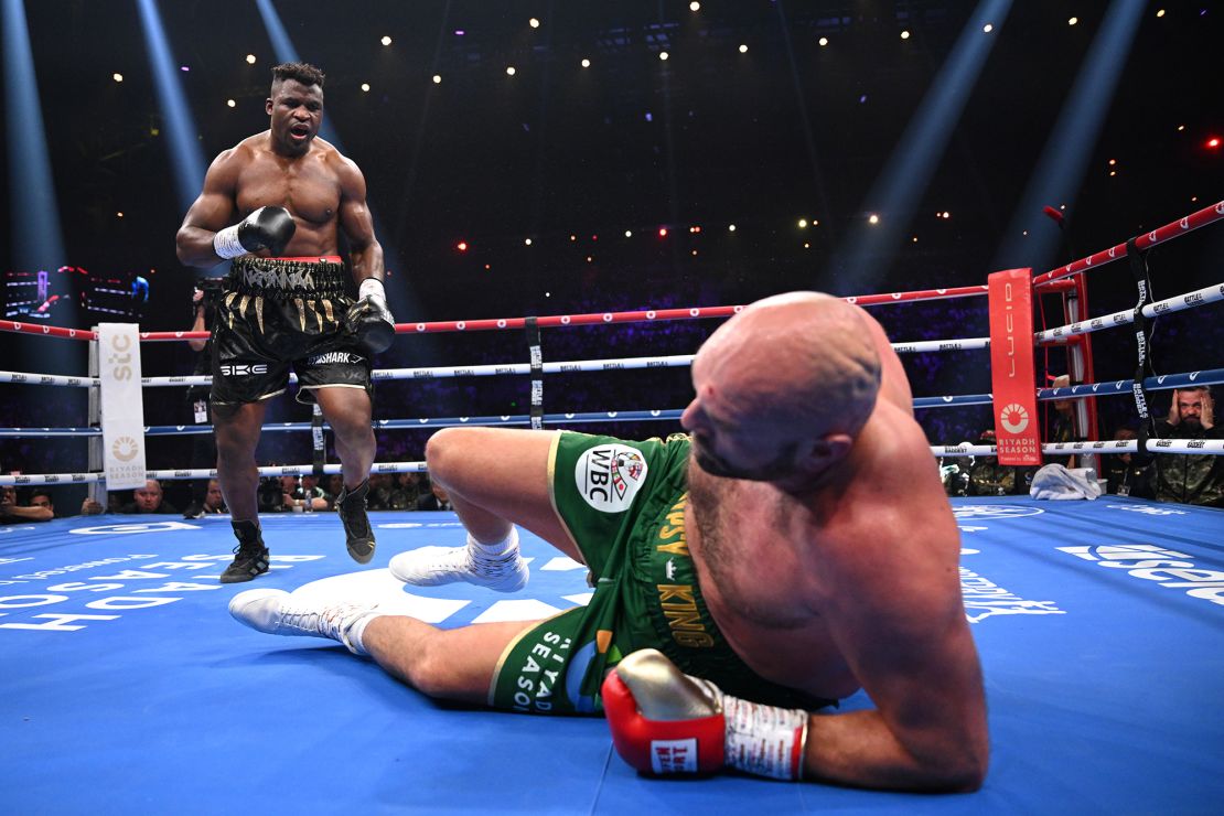 Francis Ngannou knocks down Tyson Fury during their heavyweight fight at Boulevard Hall on October 28, 2023 in Riyadh, Saudi Arabia.