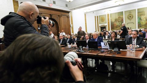 Photographers work as former President Donald Trump sits in the courtroom with attorneys Chris Kise and Alina Habba during his civil fraud trial at New York Supreme Court on November 6, 2023 in New York.