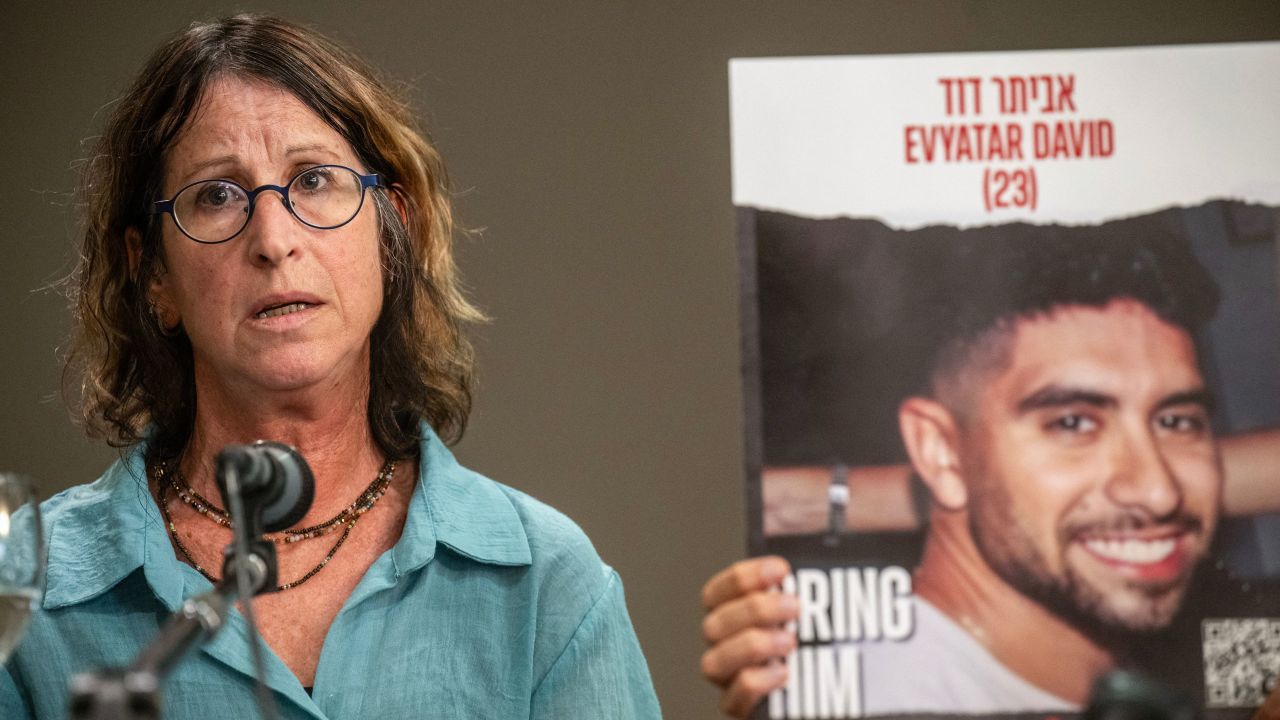 Galya David (L) speaks next to a portrait of her 22-year-old son Evyatar David, held hostage by Palestinian Hamas militants during the October 7 attack, as she attends a press conference in Athens on November 6, 2023. Israel says at least 242 hostages were seized by Hamas militants who spilled out of Gaza nearly a month ago, killing 1,400 -- mostly civilians -- in the deadliest assault on the nation since it was founded in 1948. (Photo by Angelos Tzortzinis / AFP) (Photo by ANGELOS TZORTZINIS/AFP via Getty Images)