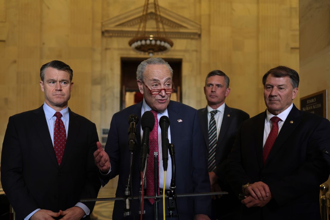 U.S. Senate Minority Leader Sen. Chuck Schumer (D-NY) speaks as (L-R) Sen. Todd Young (R-IN), Sen. Martin Heinrich (D-NM) and Sen. Michael Rounds (R-SD) listen after a meeting on AI at the Kennedy Caucus Room at Russell Senate Office Building on November 1, 2023 on Capitol Hill in Washington, DC. An AI Insight Forum was held to discuss the future practice of Artificial Intelligence.