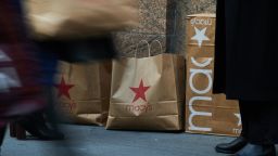Shopping bags in front of the Macy's Inc. flagship store in the Herald Square area of New York, US, on Monday, Nov. 13, 2023.