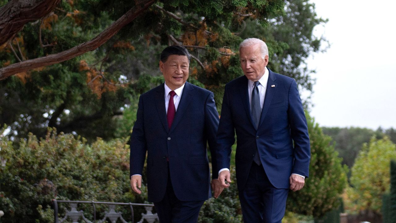 US President Joe Biden and Chinese President Xi Jinping walk together after a meeting during the Asia-Pacific Economic Cooperation (APEC) Leaders' week in Woodside, California on November 15, 2023.