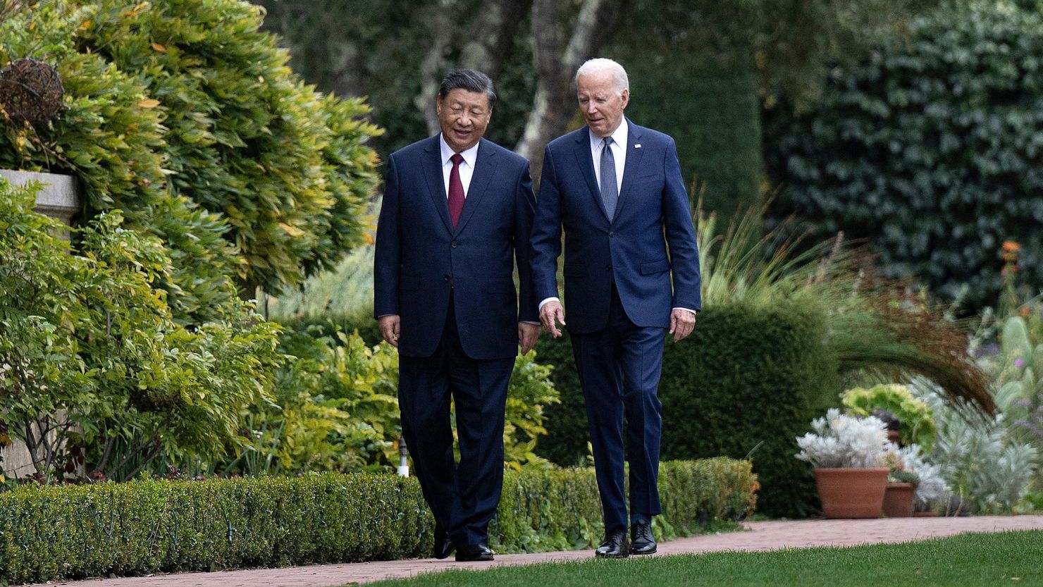 US President Joe Biden and Chinese President Xi Jinping walk together after a meeting during the Asia-Pacific Economic Cooperation (APEC) Leaders' week in Woodside, California on November 15, 2023.