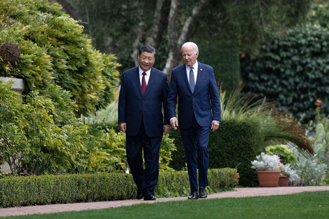 US President Joe Biden and Chinese leader Xi Jinping walk together after a meeting during the Asia-Pacific Economic Cooperation (APEC) Leaders' week in Woodside, Calif., on November 15, 2023.
