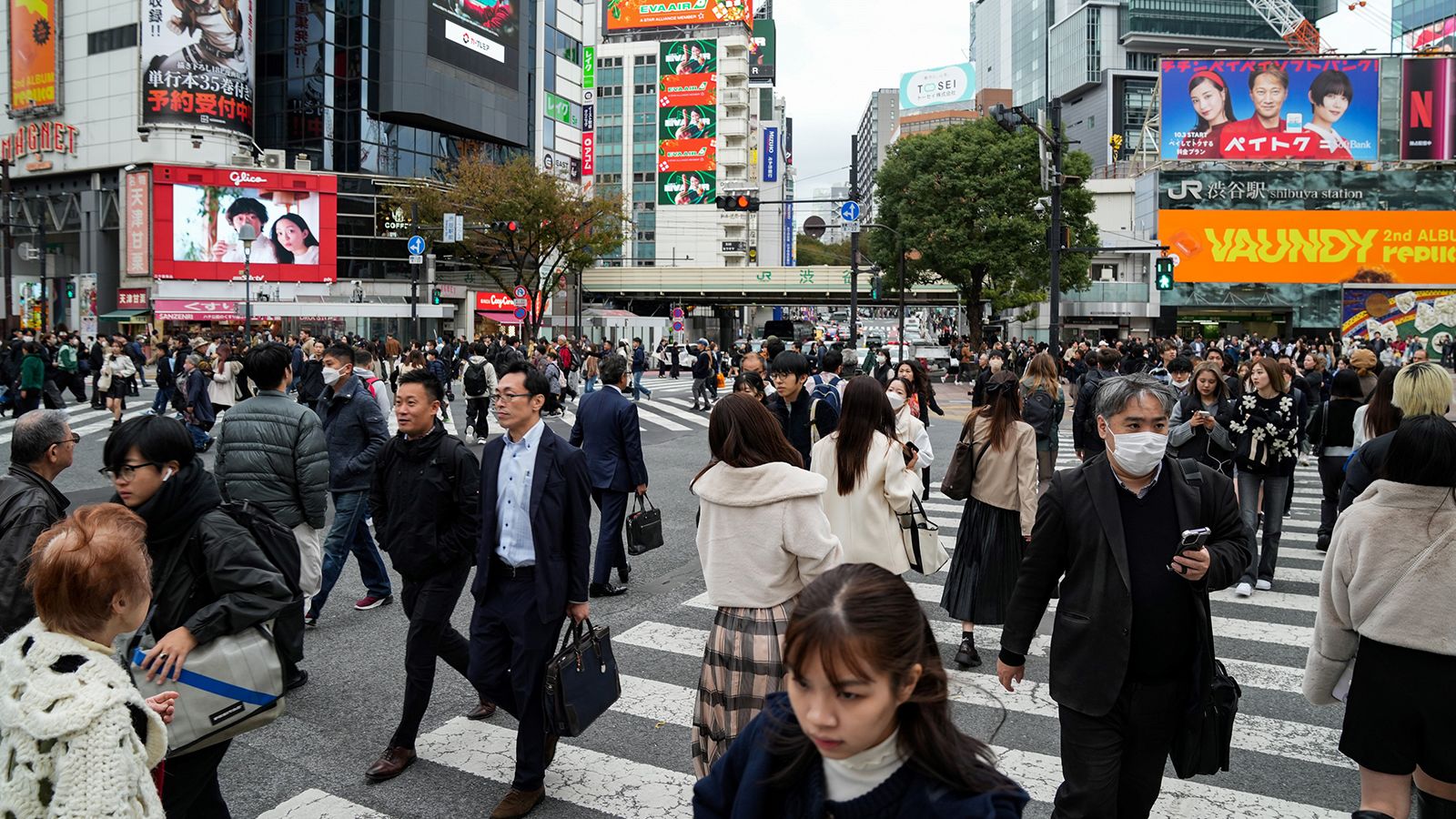 People walking past a busy crossing in Tokyo, Japan on November 15, 2023.