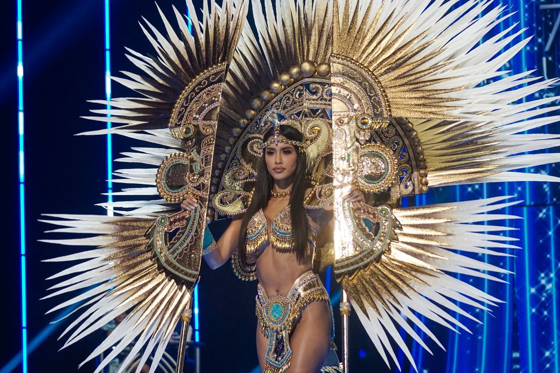 Inspired by Incan culture, Miss Peru's costume featured a large-scale representation of a tumi, a ceremonial knife. Also, lots of points feathers.