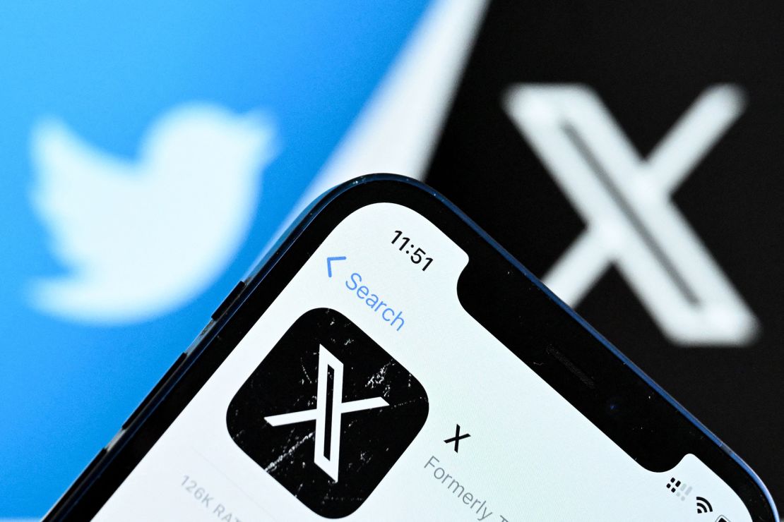 A photo taken on November 17, 2023 shows the logo of US online social media and social networking service X - formerly Twitter - on a smartphone screen in Frankfurt am Main, western Germany.