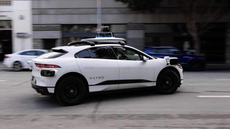 A Waymo autonomous vehicle turning onto Mission Street in San Francisco, on November 17, 2023.