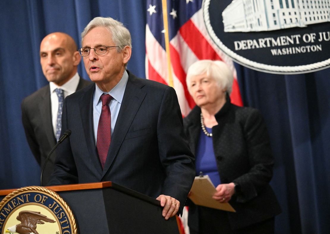 US Attorney General Merrick Garland speaks at a press conference with US Treasury Secretary Janet Yellen (R) and Commodity Futures Trading Commission (CFTC) Chairman Rostin Behnam (R) to announce actions against Binance and its CEO Changpeng Zhao.