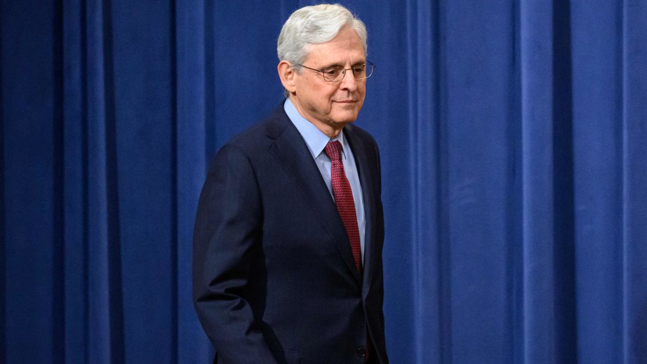 US Attorney General Merrick Garland arrives for a press conference to announce cryptocurrency enforcement actions at the Justice Department in Washington, DC on November 21, 2023.
