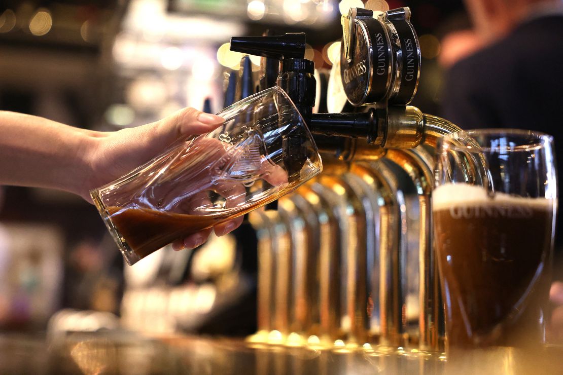 A pint of Guinness is poured at a pub in central London on November 22, 2023.