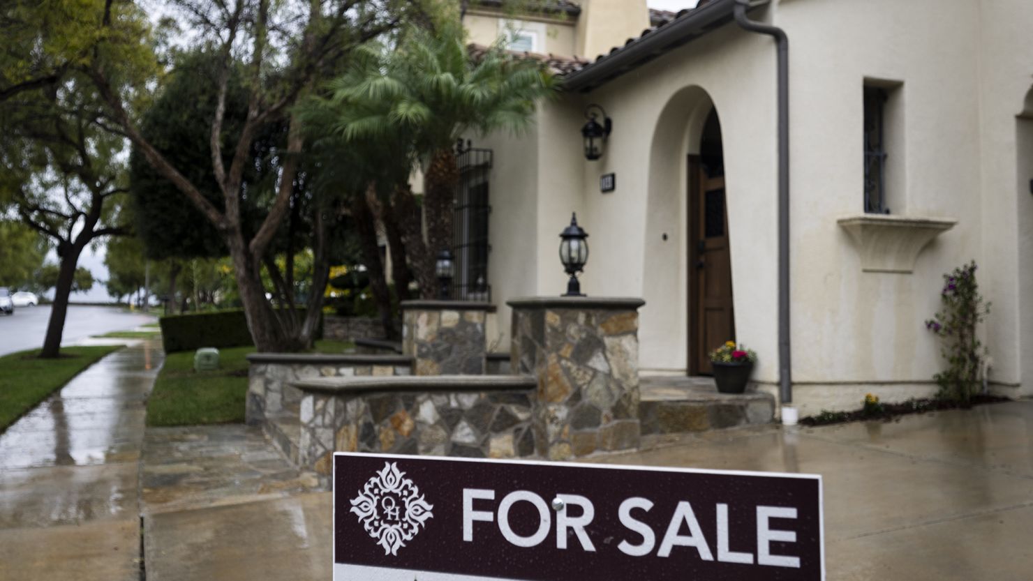 November 15: A for sale sign sits outside a home in the 100 block of Mosaic in Irvine, CA on Wednesday, November 15, 2023.
