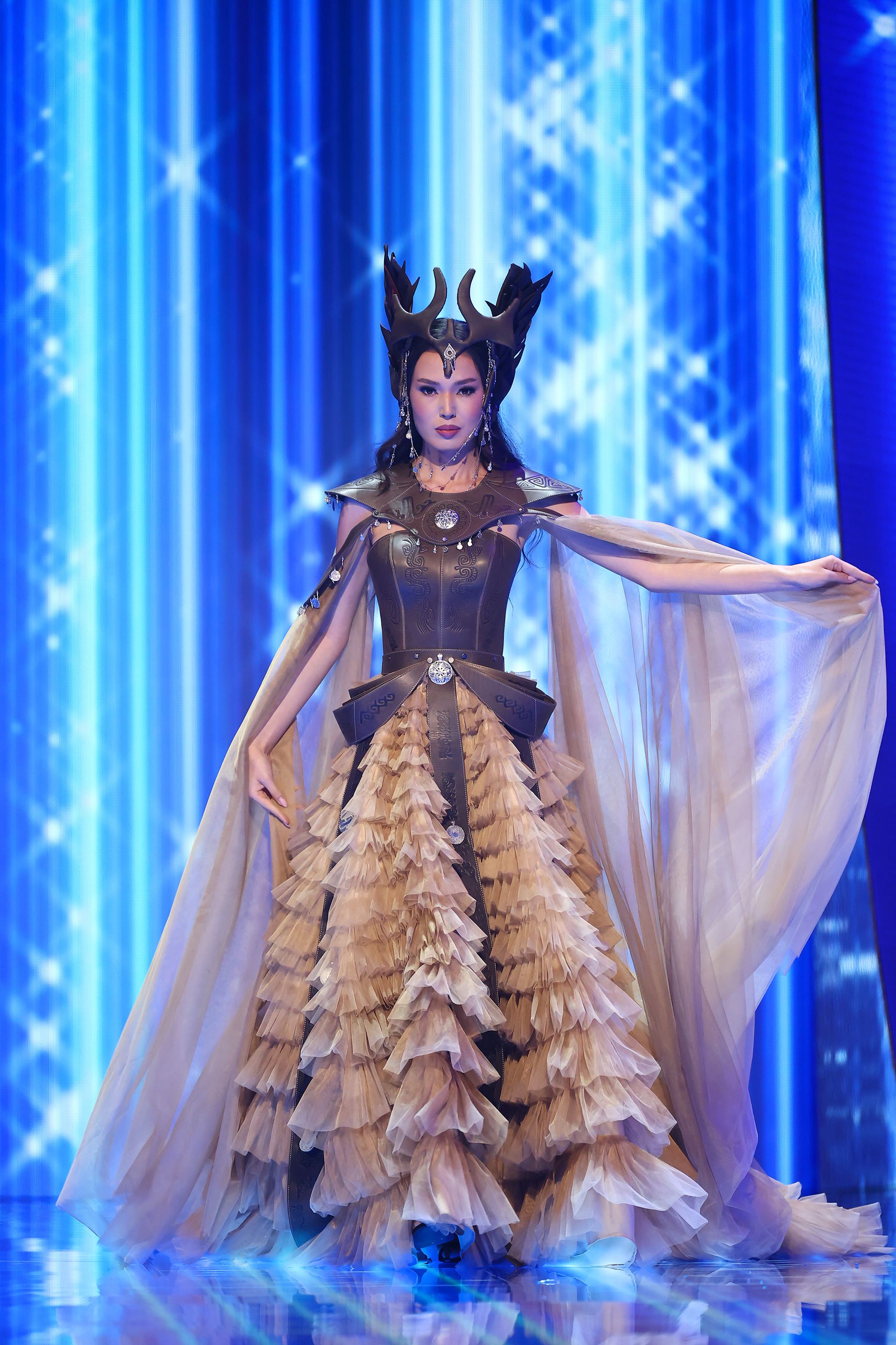 Miss Kazakhstan, meanwhile, dressed up as the ancient warrior queen Tomyris in a gown that balanced sculptural leather corsetry and a dramatic headpiece with delicate ruffles and a sheer cape.