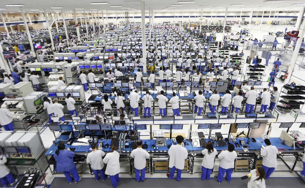 Employees assemble Motorola Solutions Inc. Moto X smartphones at the Flextronics International Ltd. factory in Fort Worth, Texas, on September 10, 2013. More than 2,000 Flextronics International Ltd. employees had been contracted to manufacture Google Inc.s Moto X smartphone.