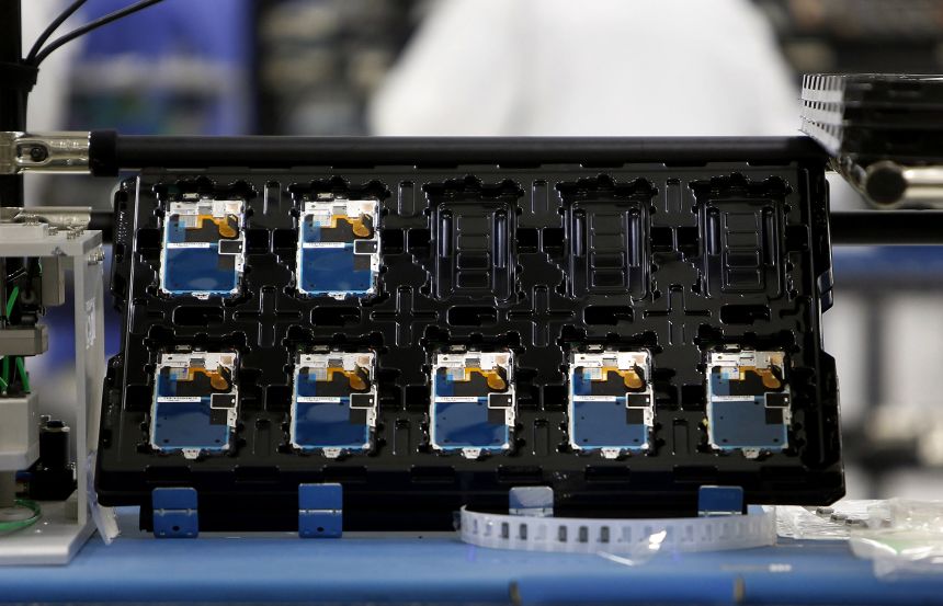 Components of Motorola Solutions Inc. Moto X smartphones are seen during assembly at the Flextronics International Ltd. factory in Fort Worth, Texas, in September 2013.