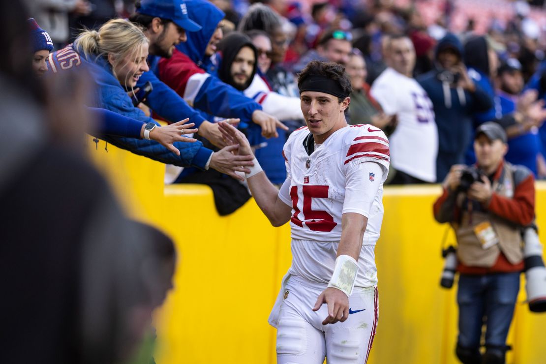 DeVito high fives fans following an NFL game between the Washington Commanders and the New York Giants at FedExField on November 19 in Landover, Maryland.