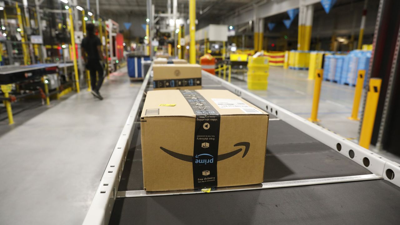 Products are seen on a conveyor belt at an Amazon fulfillment center where they are being sorted and shipped out as same day orders during Cyber Monday at the Same-Day Delivery Facility Fulfillment Center on November 27, 2023 in Tampa, Florida. Dedicated to online shopping, Cyber Monday is one of Amazon's busiest days following Thanksgiving, marked by retailers providing substantial discounts and promotions.