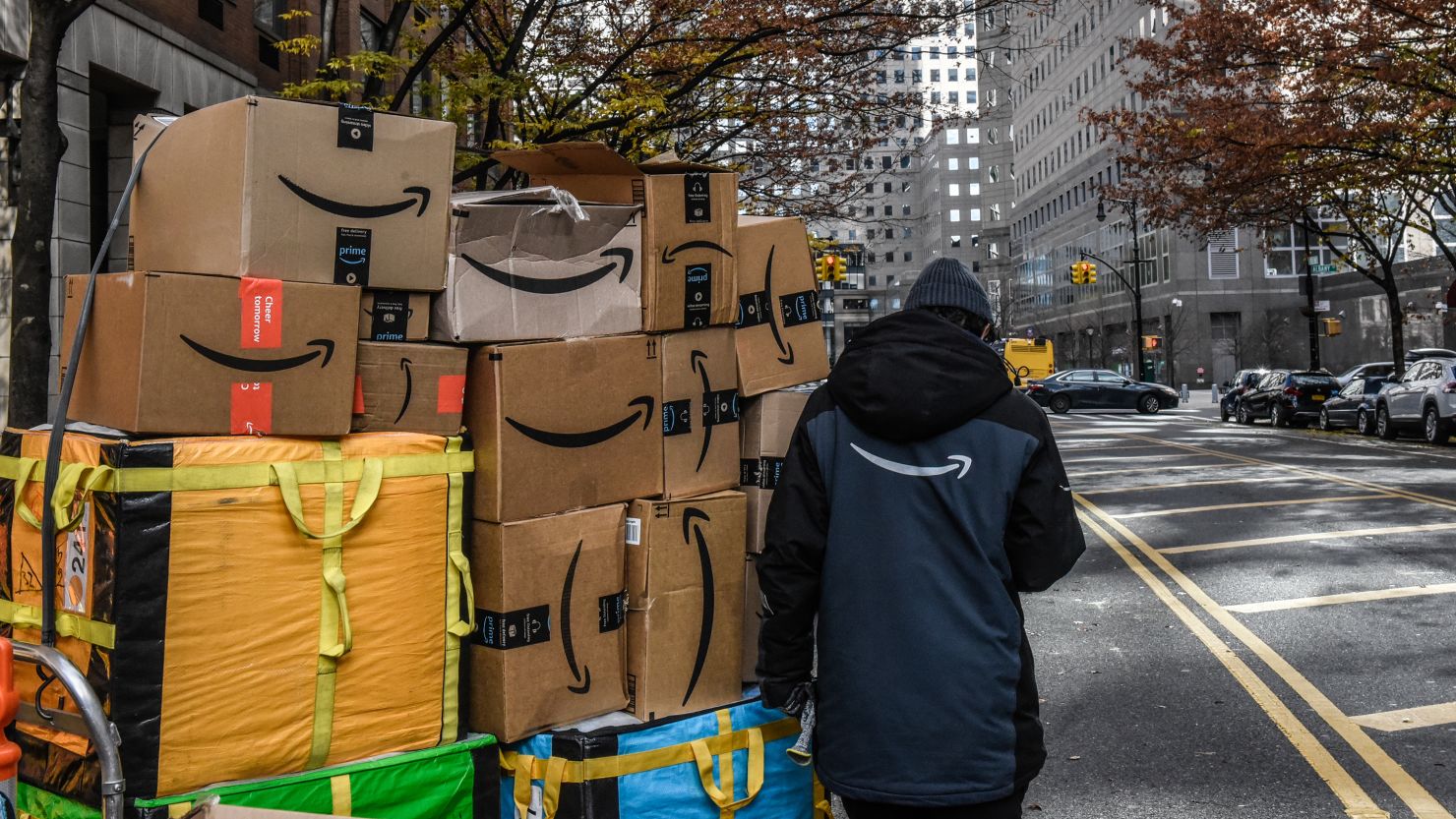 An Amazon worker delivers packages on Cyber Monday in New York on Monday, November 27, 2023.