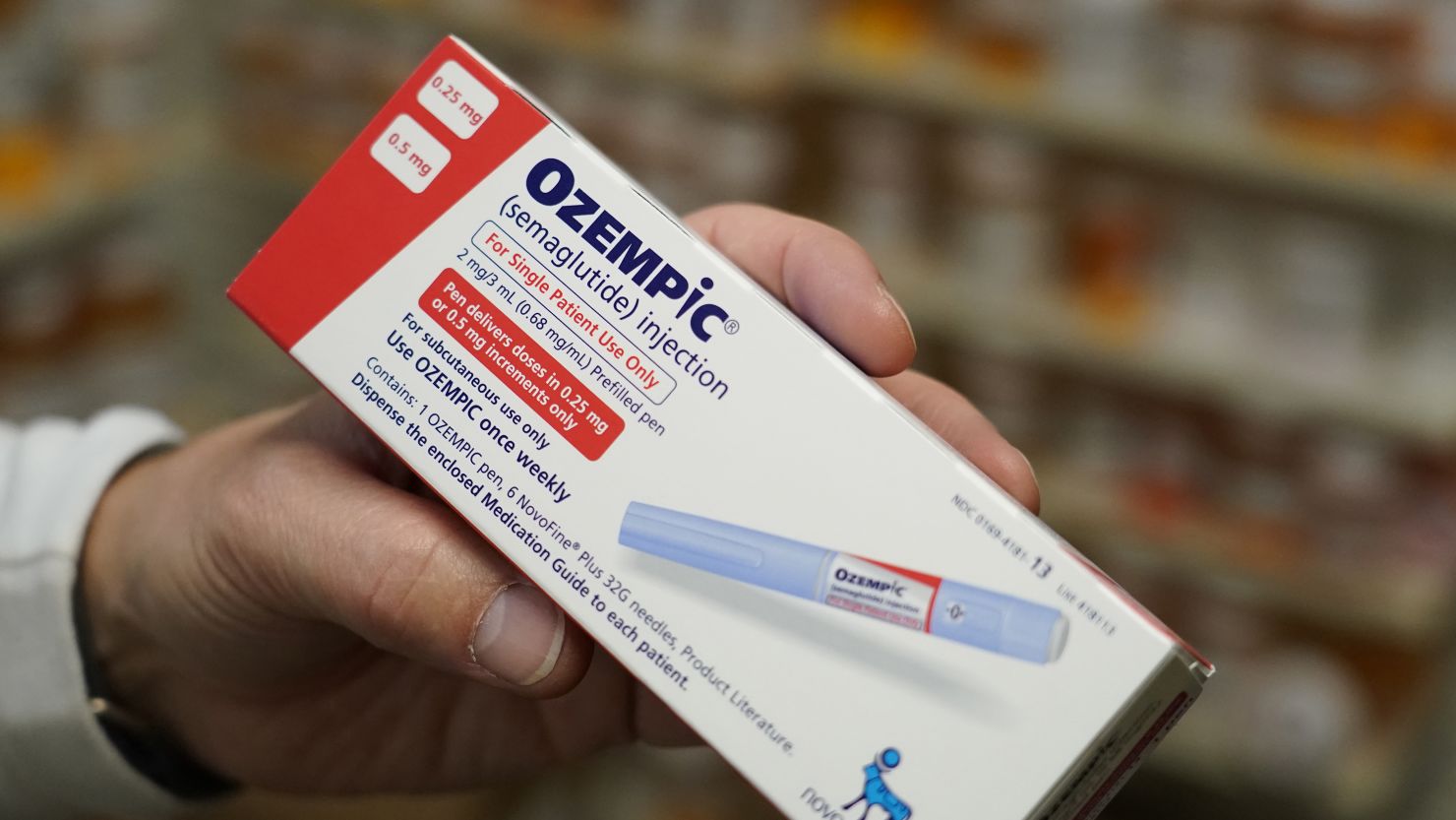 A pharmacist holds a box of Novo Nordisk A/S Ozempic brand semaglutide medication arranged at a pharmacy in Provo, Utah, US, on Monday, Nov. 27, 2023.